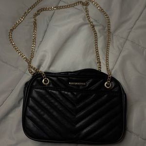 Black textured purse with gold chains